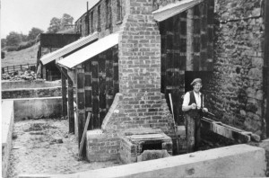 Jack Telford filling a clay pan.